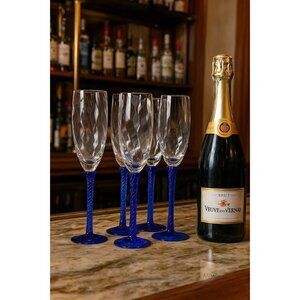 Set Of 4 Hand-Blown Champagne Flutes With Clear Bowl & Twisted Cobalt Blue Stems